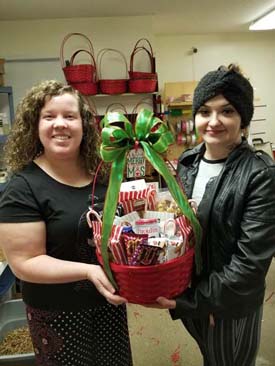 Jesse and FFM staff member Melissa show off a completed gift basket.